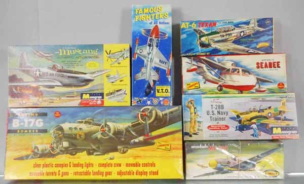 7 PLASTIC AIRPLANE MODEL KITS: Lindberg 525-249 B17G, 503-79 Republic Seabee, Monogram PA14-98 US Navy Trainer, PA77-198 USAF Mustang, Aurora 70-69 AT-6 Texan, VTO-79 Lockheed, 55-79 Messerschmitt, all unbuilt & appear complete, 2