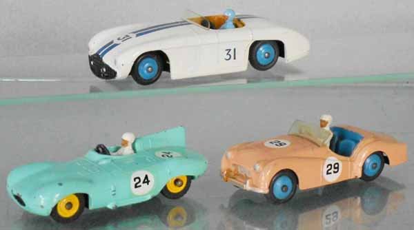 3 DINKY SPORTS CARS: 133 Cunningham C-5R, 238 Jaguar Type D, 111 Triumph TR2, graffiti on base plate, paint discoloration on 1 quarter panel, C7.