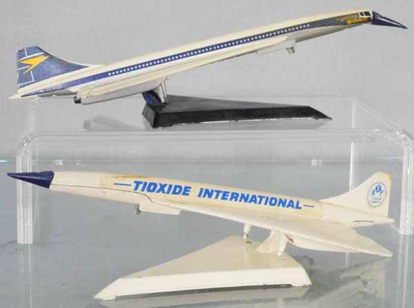 2 CORGI CONCORDE AIRLINERS: 650 BOAC, nose hinge loose, missing wheels, w/stand, 650-X Tioxide International, promo item, nose hinge loose, missing wheels, w/stand, C7.