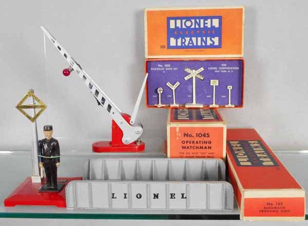 4 LIONEL ACCESSORIES: O ga, 1045 watchman, 314 girder bridge, gray, 308 RR sign set, 152 crossing gate, 3 orig boxes only, boxes minor wear, C5-9.