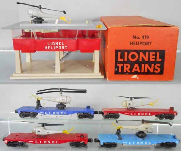 LIONEL HELICOPTER LOT: O ga, 419 heliport, crack in roof, missing 4 accessories, orig box & inserts, w/3419, 3410 & 2 #6819 flats w/helicopters, 2 helicopters broken, 1 is a repro, C5-8.