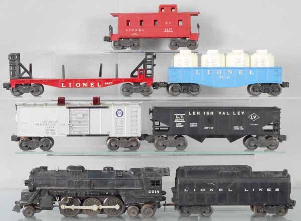 LIONEL TRAIN SET: O ga, 2018 loco, 6026W tender, 1 step broken, chip on side, 3454 merchandise car, 6456 LV hopper, 6467 miscellaneous car, 6112 gondola w/canisters, 2257 caboose, C5-6.