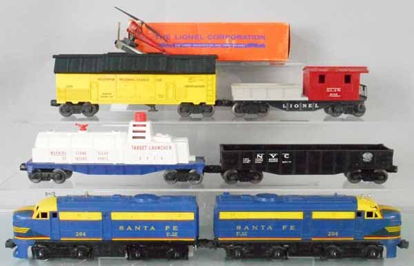 LIONEL TRAIN SET: O ga, 204 & 208 Santa Fe AA Alco diesels, both have nose decal cracks, 208 coupler bar support broken, 3470 target launcher car, missing basket, red trim piece broken, orig box some wear, 6062 gondola