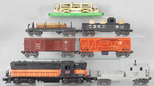 LIONEL TRAIN SET: O ga, 2338 Milwaukee Rd GP9, screw crack on 1 end, 6454 Erie box car, 3656 cattle car & platform, missing ramp, 3461 log dump, 2452X gondola w/barrels, 6419 work caboose, C5-6.