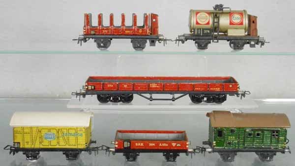 6 MARKLIN FREIGHT CARS: HO ga, ca 1947, 372 stake, 374 tank, 391 gondola, 382 banana van, 364 gondola, 390 baggage, C5-7.