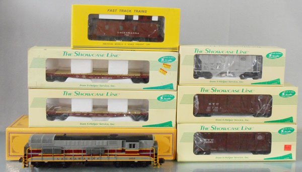 AMERICAN MODELS TRAIN SET: S ga, TMO2 Lackawanna FM, 7514B caboose, w/S-Helper Cars 007 NYC hopper, 209 CN flat, 215 Seaboard flat, 73 NYC box car, 64 NYC stock, orig boxes & inserts minor wear, C8-9.