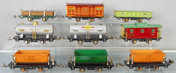 9 LIONEL FREIGHT CARS: O ga, 831 lumber, 806 stock, 902 gondola, 2 #804 tank, 807 caboose, 3 #809 dump cars, C4-6.