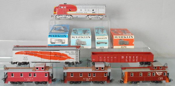 MARKLIN AMERICAN TRAIN SET: HO ga, 4062 SF diesel, playworn, C4, 4571 WP, orig box rough, 4575 Dixie Line, orig box minor wear, 4563 SP, 2 #4570 AT&SF cabooses, orig boxes some wear, cars C7-9.