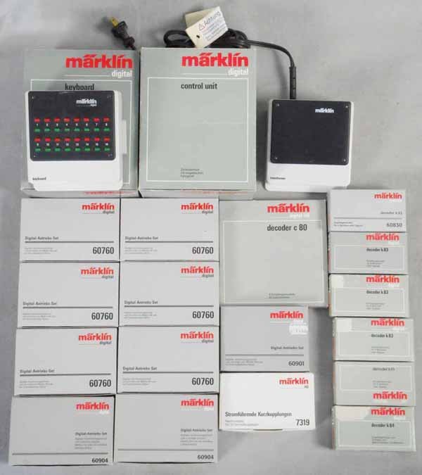 MARKLIN DIGITAL ACCESSORIES: HO ga, 2 #6040 keyboards, 6021 control unit, 6001 transformer, 6 #60760, 2 #60904, 60901, 7319, 6080, 4 #6083, 6084, 60830, all but 2 items have orig boxes, boxes have some minor wear, C8-10.