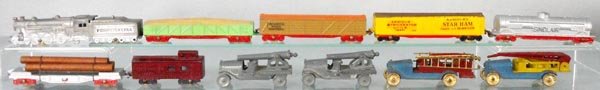 TOOTSIETOY LOT: 1086 PRR loco w/6 freight cars, 1 coupler broken, 4652 ladder truck, 4653 water tower, 2 S.R. Cannon Cars, French, C5-7.