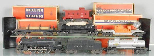 LIONEL TRAIN SET: O ga, 2026 loco, glue residue on boiler front, 6466WX tender, 6465 tank, 3451 log dump, 3469 dump, 6520 generator car, 6357 caboose, orig boxes rough, C4-5.