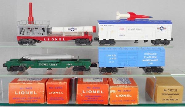 4 LIONEL FREIGHT CARS: O ga, 3413 Mercury Capsule launching car, 3665 Minuteman missile launching car, 3362 helium tank car, 3357 cop & hobo car, orig boxes minor wear, 3 flaps loose, C7-8.