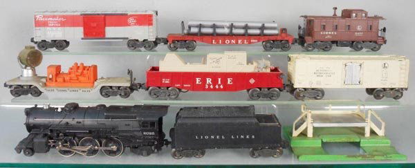 LIONEL TRAIN SET: O ga, 2025 loco, new boiler & front decal, 6466WX tender, 3020 searchlight, 6511 flat w/pipes, 3444 animated gondola, 6464-125 NYC box car, lettering worn on 1 side, 3472 milk car & platform, 6457 cab