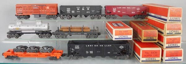 7 LIONEL FREIGHT CARS: O ga, 3656 stock, 3456 hopper, 6456 hopper, 6436 hopper, 6465 tank, 3461 lumber, 6362 truck car, orig boxes worn, only 3 are complete, C6-8.