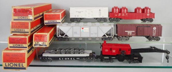 6 LIONEL FREIGHT CARS: O ga, 6472 milk car, 6462 gondola w/canisters, 6346 Alcoa hopper, 6454 PRR box car, 6262 wheel car, 6560-25 crane, orig boxes worn or rough, C6-7.