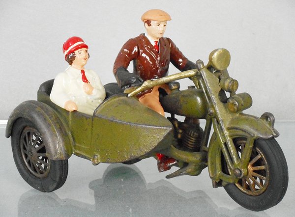 HUBLEY HARLEY DAVIDSON CIVILIAN MOTORCYCLE: painted cast iron, 9â€ long, w/2 non-iron recast figures, handlbars & front rubber tires replaced, decals worn, C5-6.