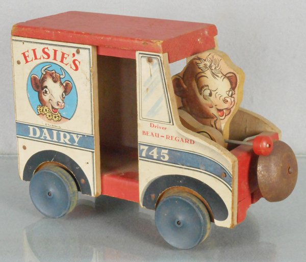 FISHER PRICE 745 ELSIE’S DAIRY TRUCK: FISHER PRICE 745 ELSIE’S DAIRY TRUCK litho paper over wood, 9 1/2 in long, cow missing 1 arm, bell tarnished, C5.