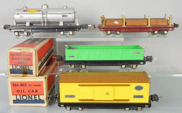 4 LIONEL FREIGHT CARS: O ga, 815 Sunoco tank, 811 lumber flat, 812 gondola, 814 box car, 2 orig boxes only, rough, C6-8.