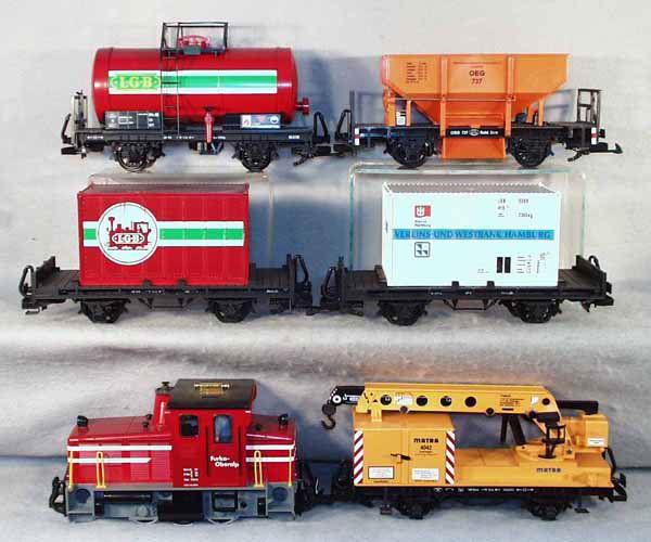 LGB TRAIN SET: G ga, 2061 loco w/cars 4042 derrick, 2 flats, each w/different container, LGB tank car, 4041 ore car, 4021 gondola, gondola not shown in photo, C7-9. Complete information covering terms, conditions, p