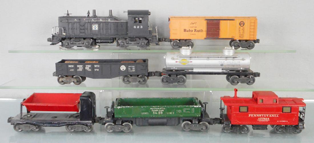 LIONEL TRAIN SET: O ga, 623 Santa Fe switcher, 2454 Baby Ruth box car, 2452 gondola, 2465 Sunoco tank, 3559 coal dump, 3459 automatic dump car, 2457 caboose, C5-6.