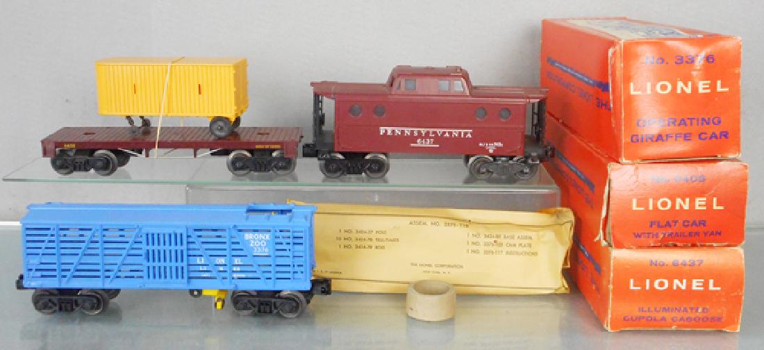 3 LIONEL FREIGHT CARS: O ga, 6405 flat w/trailer van, 6437 caboose, 3376 operating giraffe car, orig boxes worn, C9.