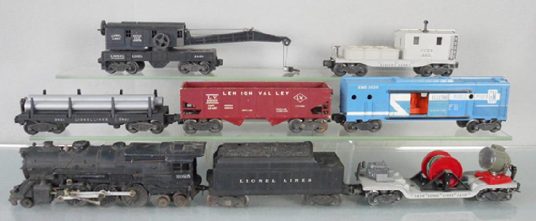 LIONEL TRAIN SET: O ga, 2025 loco, box rub on roof, 6466W tender, minor crack to front end, 3650 searchlight car, 3461 dump car w/pipes, 6456 LV hopper, repaired chip to 1 top corner, 3530 Electro Mobile Power generato