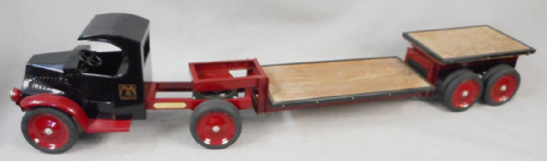 LES PAUL BULLDOG MACK LOWBOY TRUCK: contemporary, painted pressed steel & wood, 49 in long, C8.