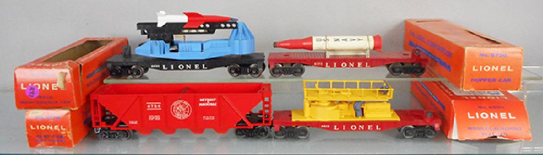 4 LIONEL FREIGHT CARS: O ga, 6650 missile launching flat, 6175 flat w/rocket, 6736 hopper, 6812 track maintenance car, orig boxes, 3 worn, C6-8.