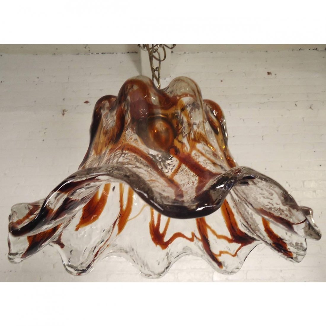 Sculpted Blown Glass Petal Lamp by Mazzega: Vintage modern blown glass hanging pendant with a lovely wilted petal shape. Wild and colorful design with bronze stem and long brass chain. ---Seller Reference Number0359-00433Nc---ConditionGood. Min