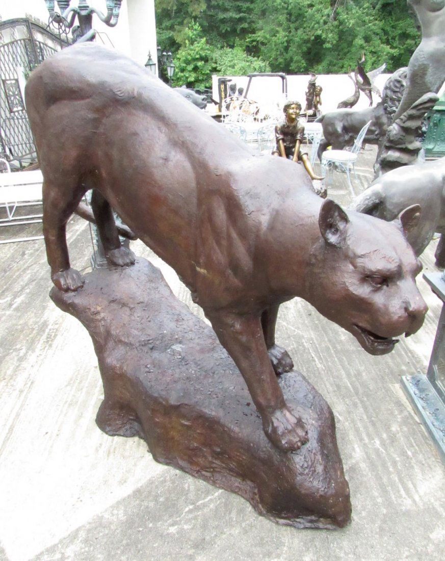 Life-Size Bronze Panther Statue: Impressive figurative bronze statue depicting a panther with life-like scale and details. Quality bronze construction ensures this piece will continue to impress for years to come. A great addition to