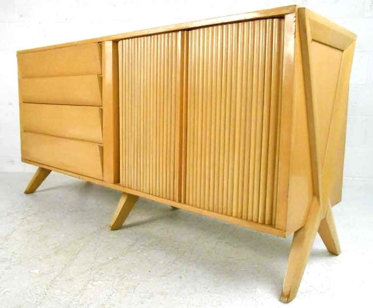 2-of-2 Vintage Modern Bedroom Dresser after Paul Laszlo: Bold midcentury design with flared legs, tambour doors, and eight drawers for storage. ---CONDITION DETAILSage appropriate wear, vintage finish worn, scuffs/scratches/edge wear, some restoration may b