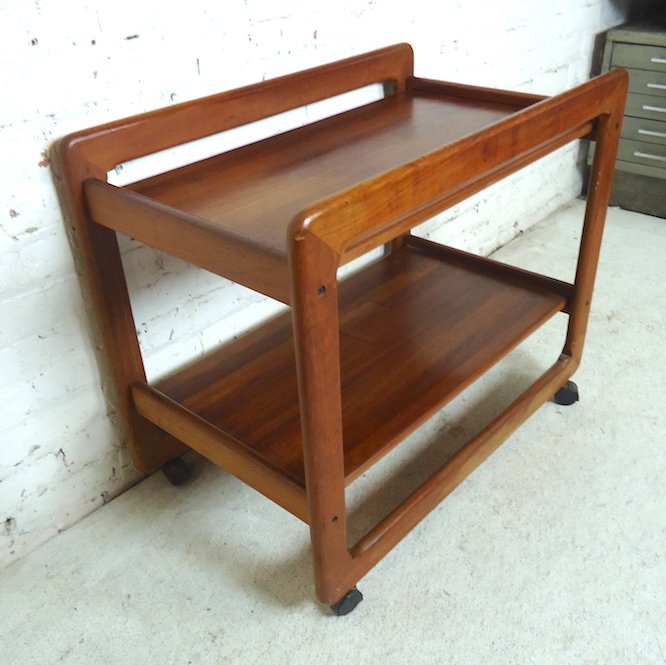 Rolling Teak Cart: Mid-century style teak wood bar cart with shelf.---DIMENSIONS: 34"w/19.5"d/28"h---LOCATION: Brooklyn NY---REFERENCE: 4413-05346NS