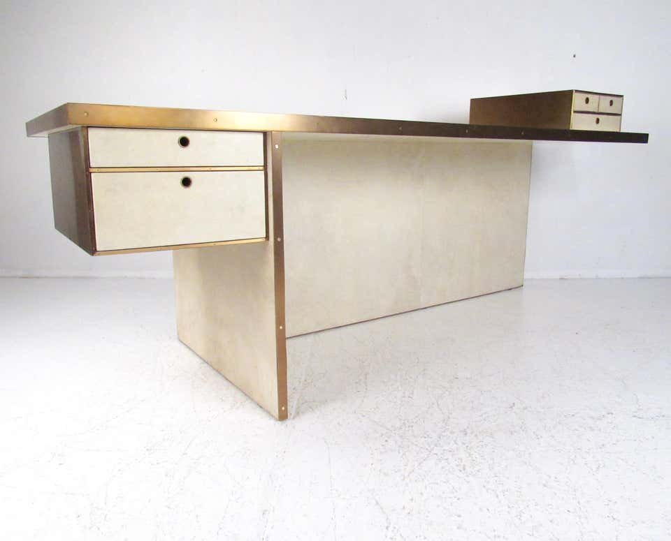 "Dillon" Executive Desk by Kelly Wearstler: The "Dillon" desk is impressive modern executive piece by Kelly Wearstler makes an elegant and substantial addition to home or business office. Unique ivory parchment finish is complimented by burnish
