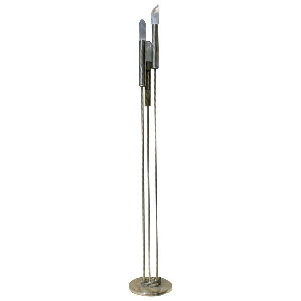Unique Floor Lamp with Lucite Prisms: Mid-Century brass lamp with three vertical arms and Lucite caps. Shades can be pointed to the wall for softer room light. Three candelabra sockets and switch on base.---Dimensions: Height: 69 in., Dia