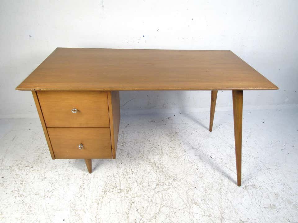 Midcentury Desk by Paul McCobb, Planner Group: Classic midcentury desk designed by Paul McCobb for Winchendon's "Planner Group". Maple wood construction, with tapered and splayed legs.---Dimensions: Height: 29 in., Width: 48.5 in., Depth: 24.25 in