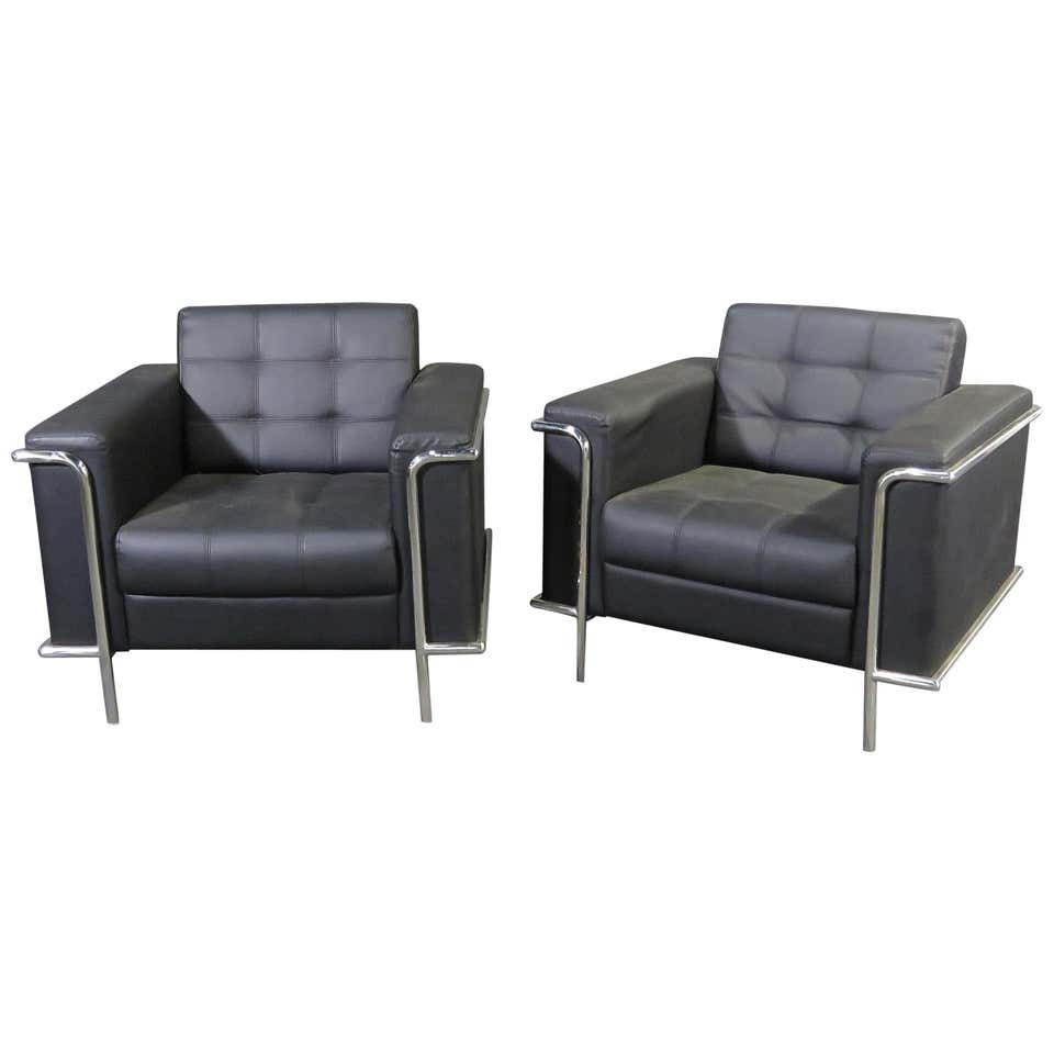 Pair of Cassina Style Cube Chairs: Vintage modern style Cassina chairs featured in vinyl upholstery on a set of sturdy chrome legs.---Dimensions: Height: 32 in., Width: 36.5 in., Depth: 32.5 in., Seat Height: 18 in.---Seller Location: