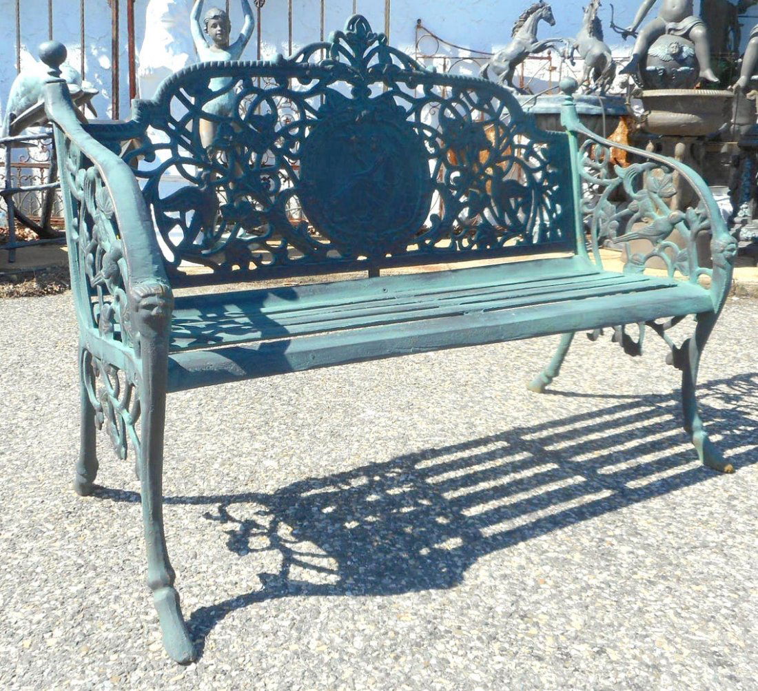Cast Iron Bench: This beautiful cast iron bench features a sculpted frame with a decorative backrest and arm rests. A sturdy design with splayed legs and a slat seat. This functional and stylish bench looks incredible