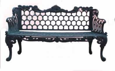Cast Iron Bench: Outdoor bench with honeycomb back.--LOCATION: New Jersey--DIMENSIONS: 60.5", 17", 35"