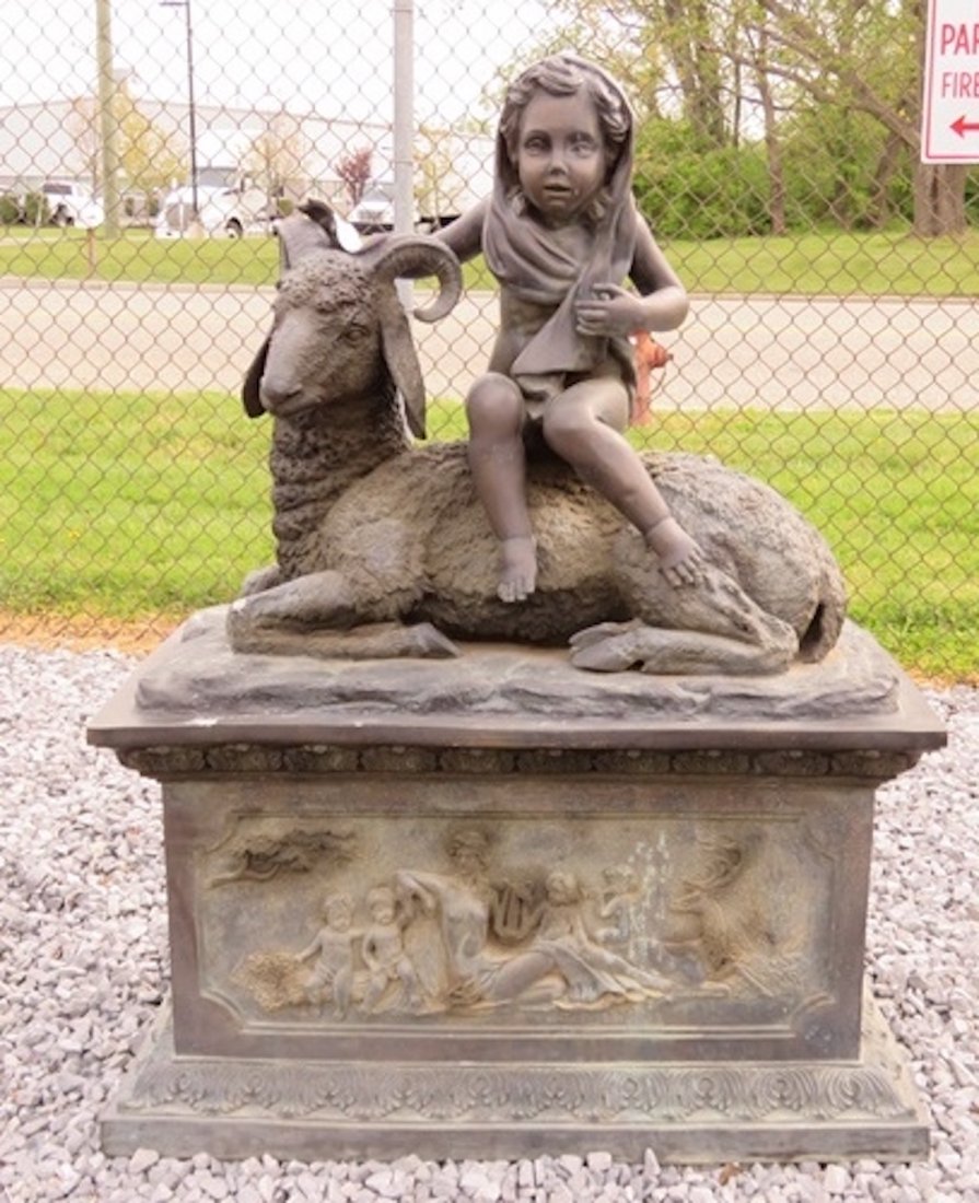 Bronze Statue of Child with Goat: Garden statue in bronze of child with sitting goat.--DIMENSIONS: 43", 22.5", 56.5"--LOCATION: New Jersey