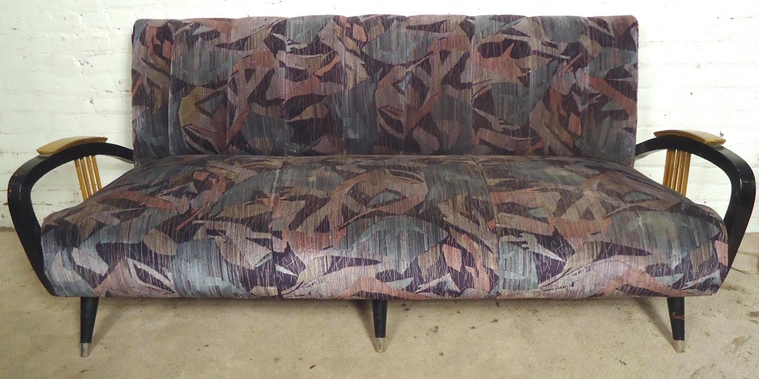 Mid-Century Sofa: Vintage modern love seat made by Malden Mills Inc with black wood frame.--DIMENSIONS:--LOCATION: Brooklyn NY--CONDITION: Some age wear - nicks, scratches, chips, small rips to fabric