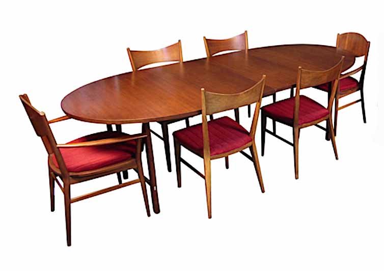 Dining Room Set by Paul McCobb: Add timeless Mid-Century Modern style to your dining room with this vintage set by Paul McCobb. It includes an expanding dining table, six chairs (2 with arms, 4 without). // PICK UP LOCATION: New Jer