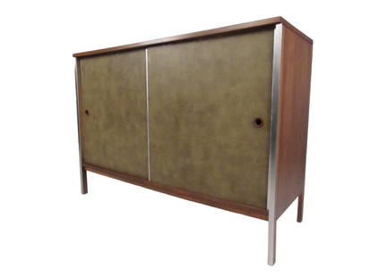 Sliding Door Cabinet by Paul McCobb: Leatherette covered sliding door cabinet with aluminum trim accents from the Paul McCobb Calvin collection. // PICK UP LOCATION: Wall, NJ // Dimensions: Depth 18 in Width 48 in Height 34.25 in // Cond