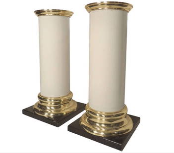 Pair of Vintage Pedestal Columns from the Taj Mahal Casino: Round plastic off white pillars with brass color tops and bases set on black stands. Tagged underneath with the Trump Plaza Casino tag. // PICKUP LOCATION: BROOKLYN // DIMENSIONS: Height: 37 in (93.98