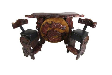 Elaborate Vintage Dragon Tiki Bar Set by Witco: Unusual midcentury Witco style bar and pair of stools. Intricately carved details throughout, with a depiction of a dragon at the forefront of the bar. The backside of the bar has room for storage of