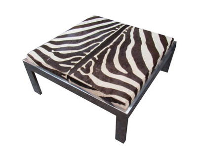 Large Zebra Hide & Chrome Ottoman/Bench: Kick back and sprawl out on this fantastically unique funky vintage jumbo zebra ottoman! With over 10 square feet of real hide upholstery, this piece truly brings home the excitement of the safari int