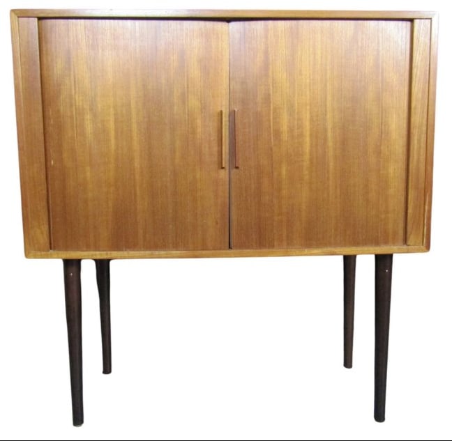 Tamboured Teak Cabinet by Kai Kristiansen for Feldballes Denmark: Here is a truly one-of-a-kind cabinet designed by Danish furniture legend Kai Kristiansen for FM Møbler. Featuring finely articulated tambor doors and a wonderfully warm teak grain, this wall-mountab