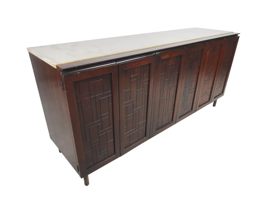 Mid-Century Modern Credenza with Travertine Topper from John Stuart: Impressive midcentury credenza from John Stuart, designed by Bert England. A handsome piece with brutalist style panels lining the cabinet fronts. Hinged cabinet doors open to reveal drawers with dove