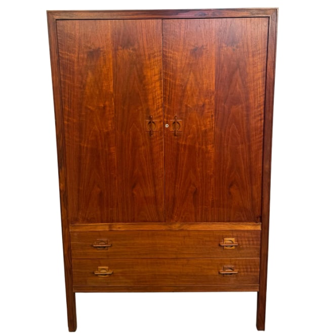 Scandinavian Teak Armoire by J Clausen for Brande Mobelfabrik: This stylish Scandinavian Modern armoire by J Clausen for Brande Mobelfabrik features exquisite teak construction, dovetail joints, and unique carved handles. Substantial piece of quality Mid-Century