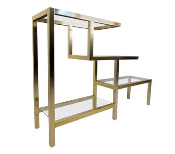Vintage Modern Low Bookshelf after Milo Baughman: Vintage-modern Milo Baughman style bookcase featuring sculpted body with brass finish and four glass shelves. Stunning display shelf for home, office, or business use. // PICK UP LOCATION: Wall, NJ //