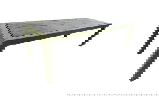 Midcentury Metal and Faux Stone Coffee Table: This rugged coffee table features a sturdy metal frame with a very unique "textured" paint job. The center is a metal slab that has been made to resemble slate stone. With a large surface area, this p